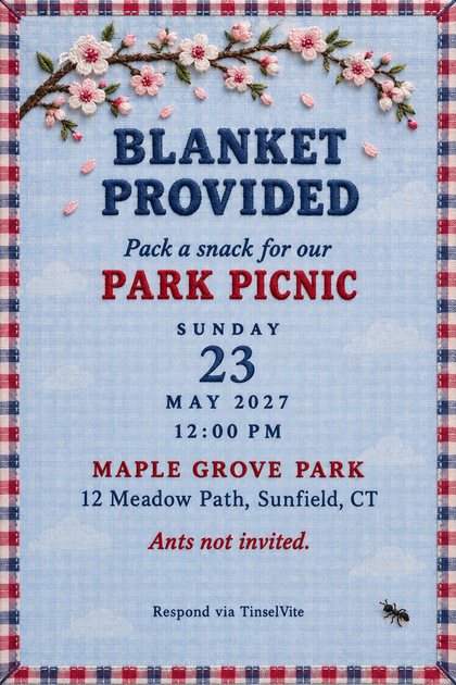 Picnic invitation on pale blue chambray with a plaid ribbon border, an embroidered cherry blossom branch, a tiny ant patch, and the title Blanket Provided, with date and venue below.