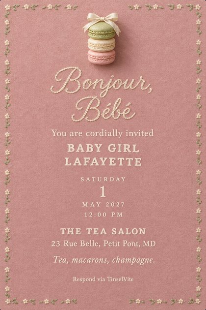 Dusty pink card edged with tiny cream and pistachio embroidered flowers. Three stacked macarons with a satin bow above script reading Bonjour, Bébé and BABY GIRL LAFAYETTE, date and venue below.