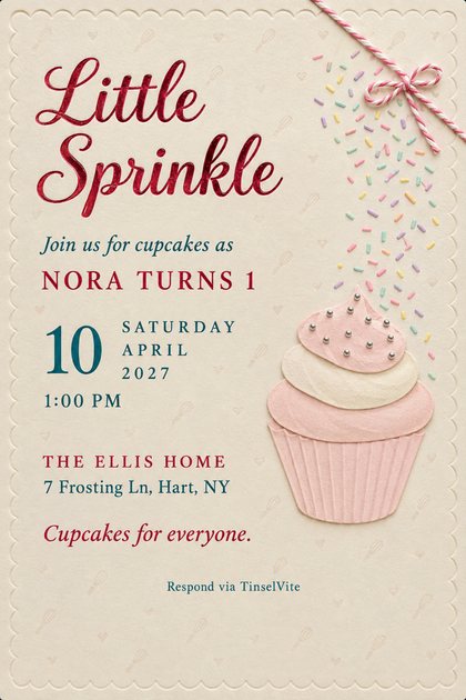 First birthday invitation on cream cardstock with a red foil script title, a pink paper cupcake with silver pearls, falling sprinkles and a twine bow, with the date and venue below.